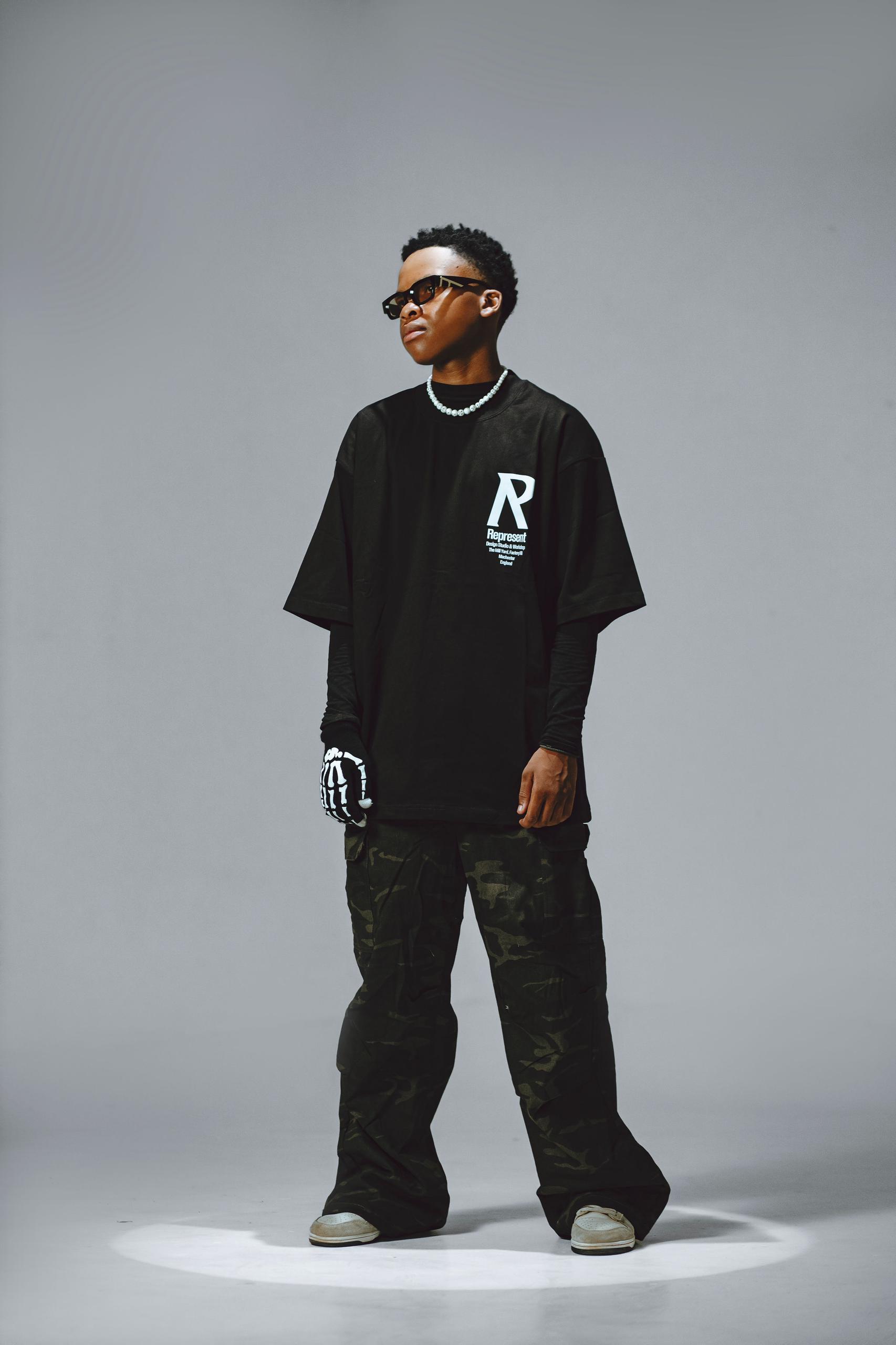 Sane.wav standing in spotlight